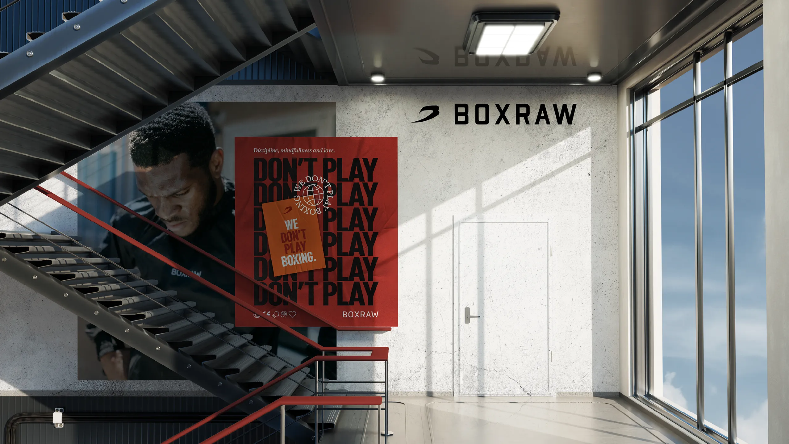 BOXRAW &lsquo;Don&rsquo;t Play&rsquo; campaign poster mounted in a stairwell atrium, with the BOXRAW wordmark on the wall behind.